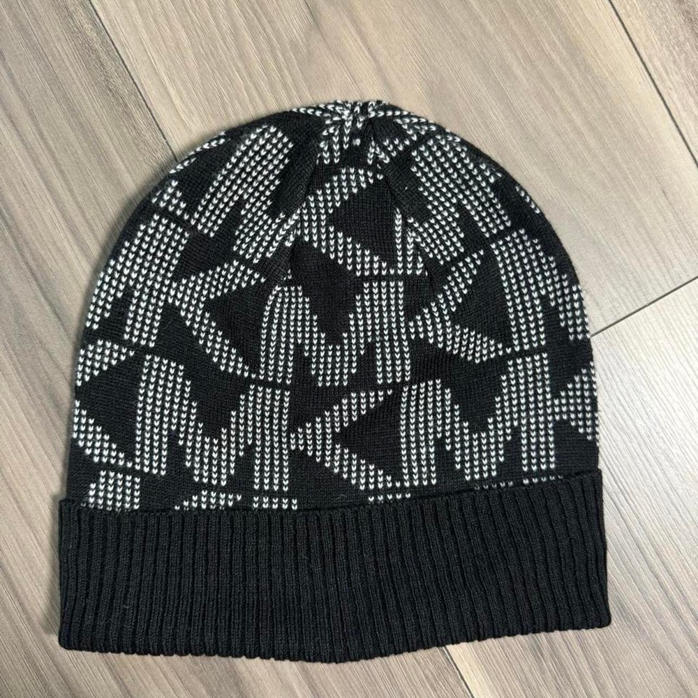 Black Michael Kors winter beanie with a classic, cozy design